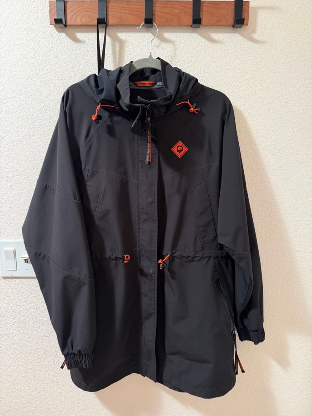 Black Hooded Anorak Jacket with Orange Accents